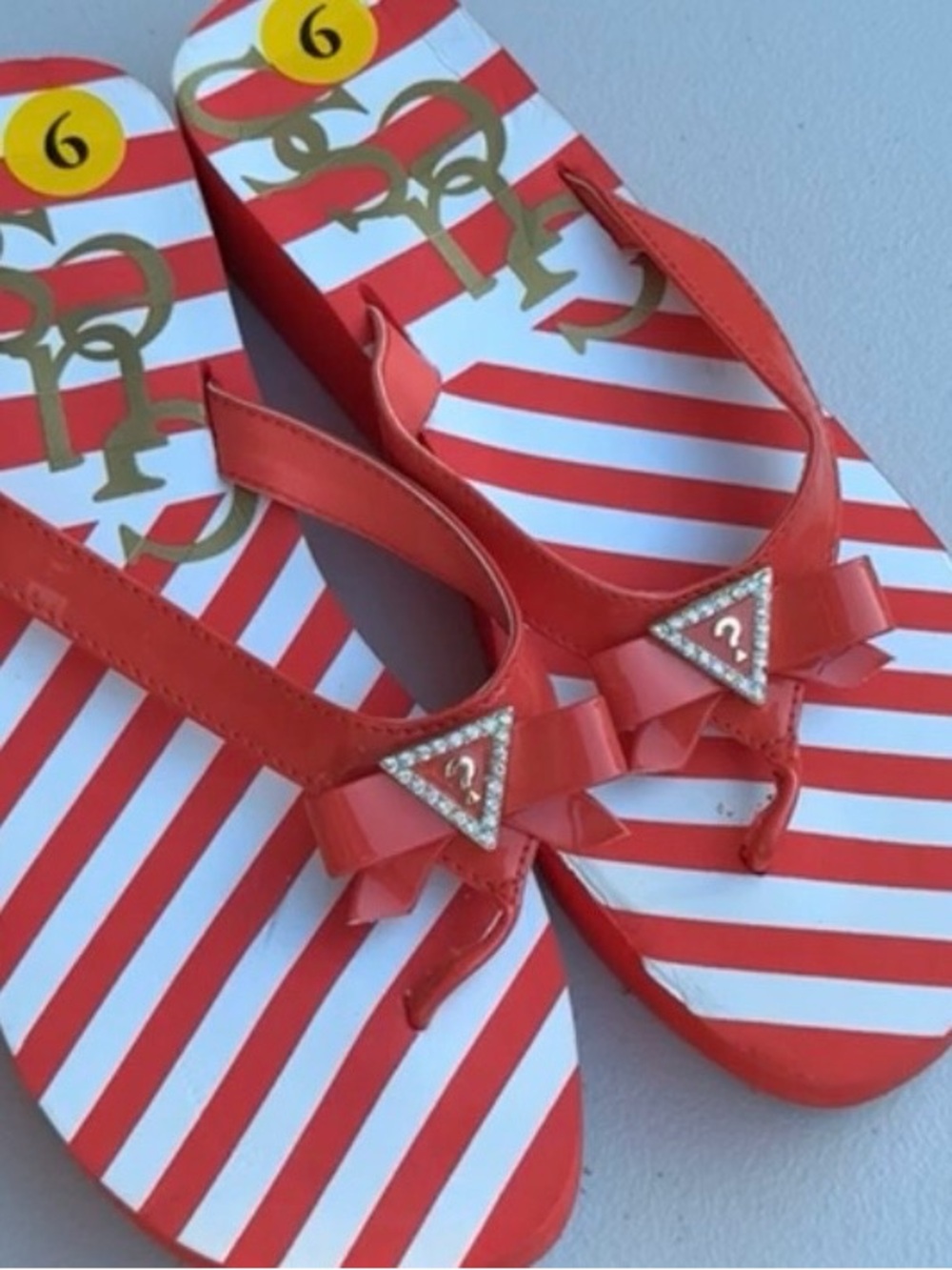 Guess Coral Striped Bow Thong Sandals with Crystal Triangle Logo